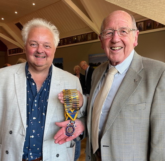 Immediate Past President Ray Thompson passed over the chains of office to Peter Chicken